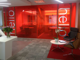 red tinted glass in an office with two chairs and a table outside