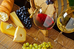 Wine, cheese and grapes on a table
