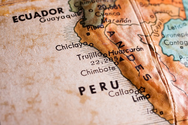 map of peru printed onto an orange stained fabric