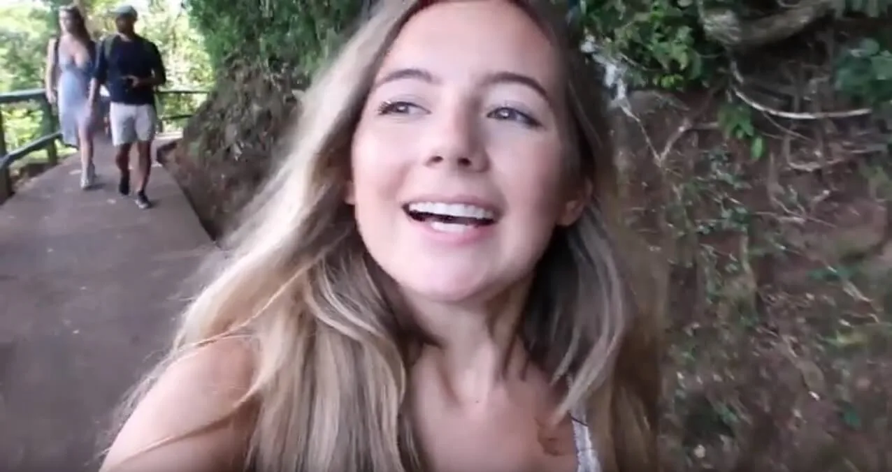 Screenshot of Gabriella Manchester walking on pavement up a hill