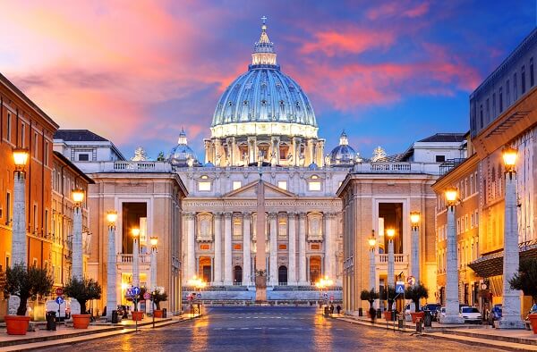 street in vatican city directing towards tall building