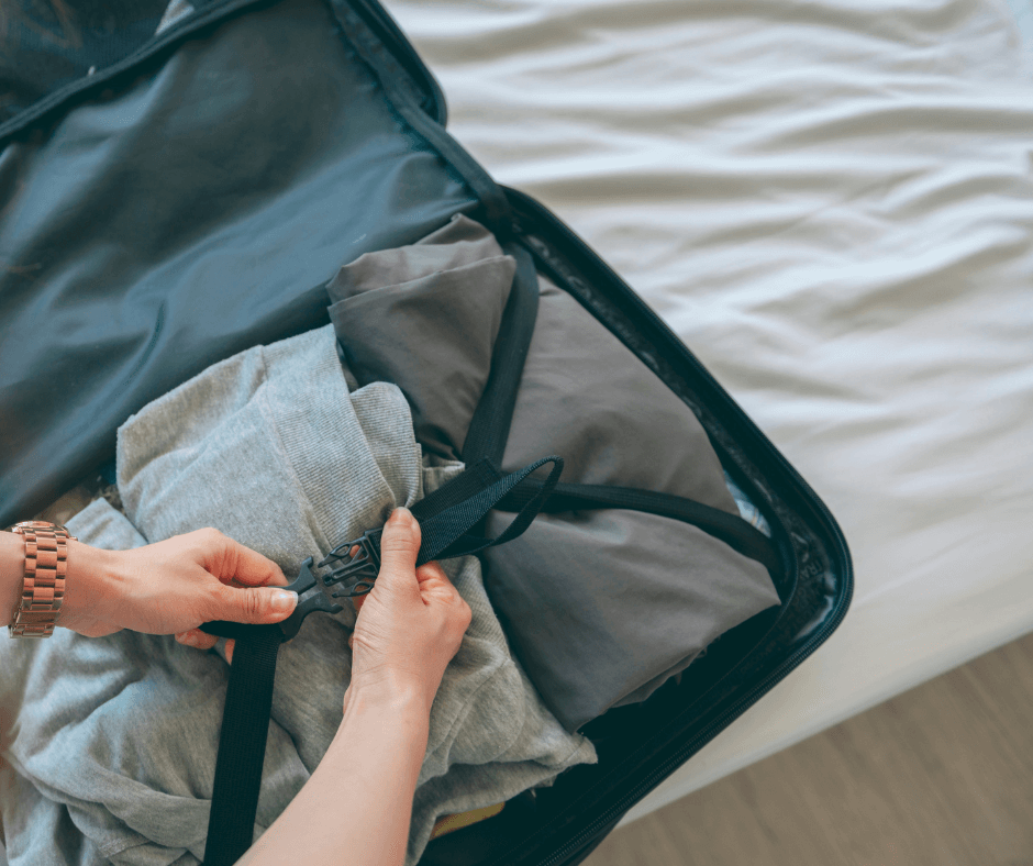 Person packing suitcase