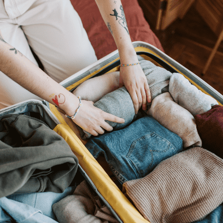 Person packing suitcase